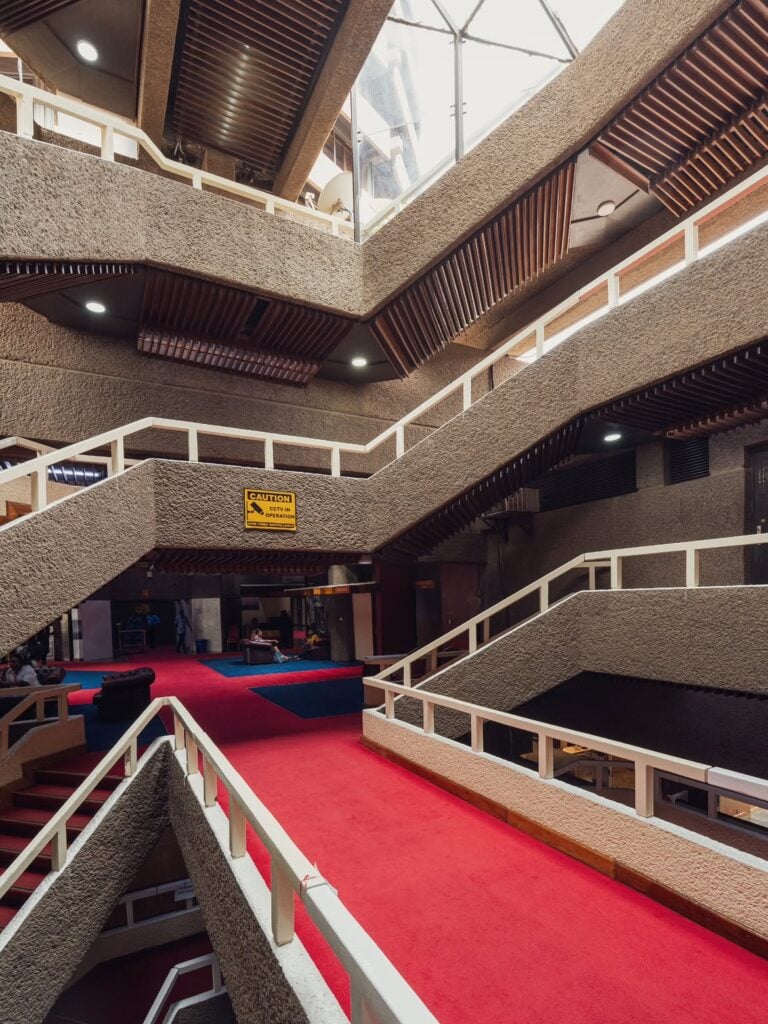Concrete staircases winding through the atrium of Nairobi's KICC