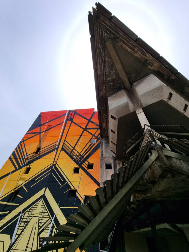 A weathered concrete corner of La Pyramide in Abidjan