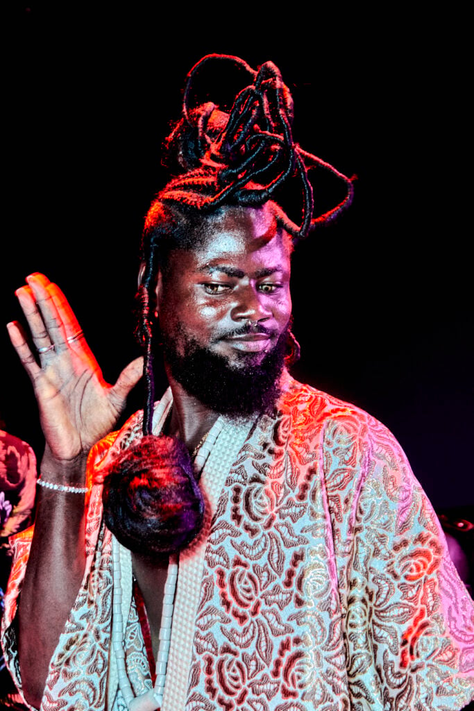 A performer walking the Face category at the Pride in Lagos Ball