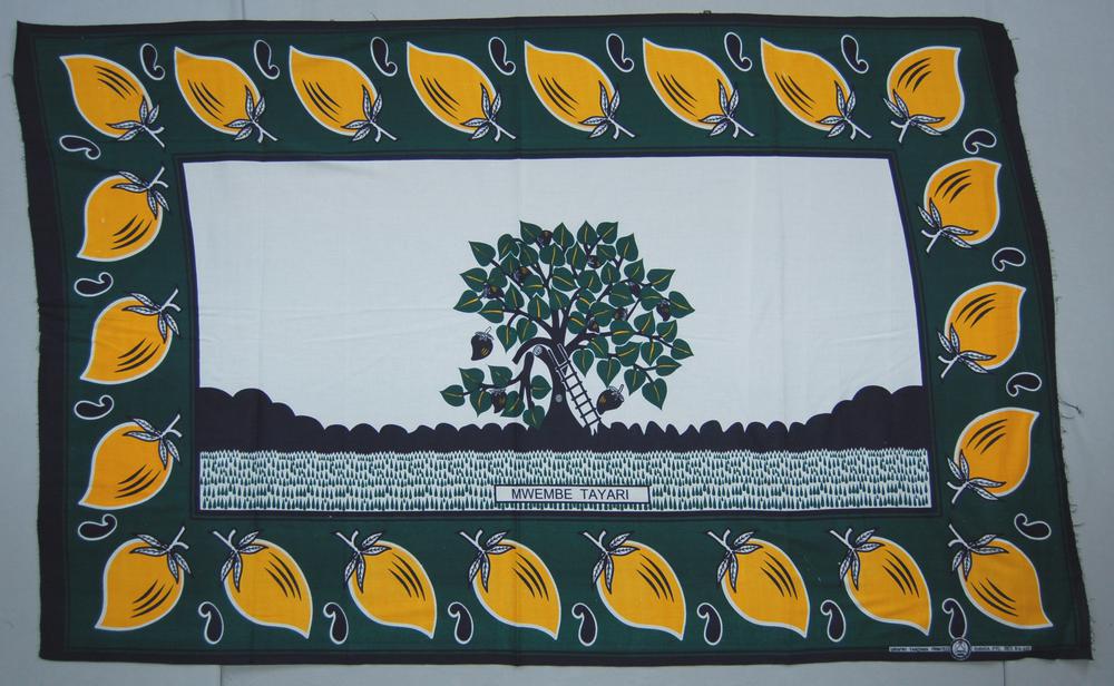 Tanzanian kanga with mango and cashew motifs, a central tree and the Kiswahili phrase Mwembe Tayari.
